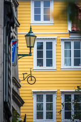 Windows of an old yellow house in Bergen