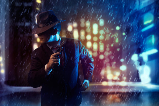 Mafia man with money, gun, hat & red tie searching enemies on noir city lights night background.