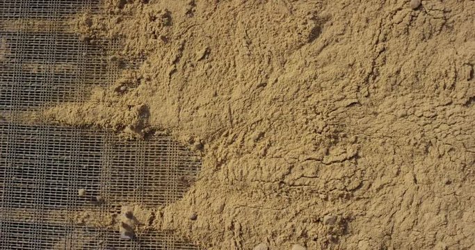 Soil, clay moving on conveyor separator. Sand, gravel, separation and refinement process. Clay mining.