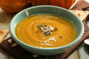 Homemade Thick and Creamy Pumpkin Soup, close up selective focus