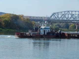 Tug on the river. River pusher jet 150 HP. Photo.