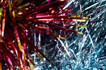 Red, yellow and blue tinsel macro