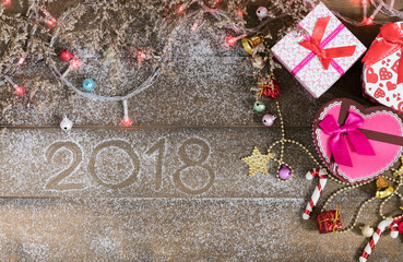 Christmas background, light and gift box with child boots