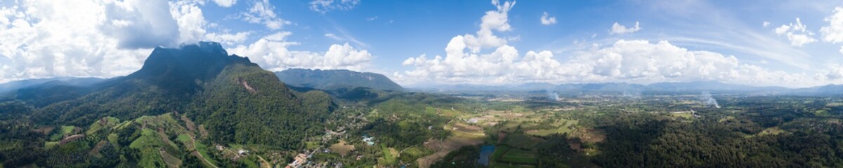 Fototapeta na wymiar Aerial top view photo from flying drone of the Buddhist temple and fields in the countryside of Chiang Mai, Northern Thailand