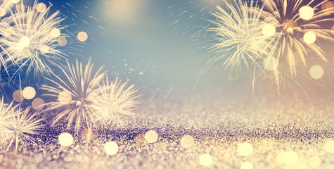 Gold and blue Vintage Fireworks and bokeh in New Year eve and copy space. Abstract background holiday.