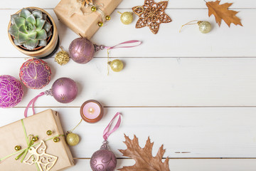 Temari balls, a handicraft ball in traditional Japanese style. Christmas composition with a gift, succulent, and Christmas decorations. Flat lay, background, top view