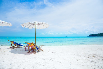 Sun loungers and beach umbrellas on the beach.