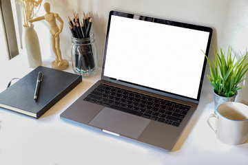 Mock up : Workspace white wood desk with blank screen labtop, book and coffee. copy space for products or graphic montage.