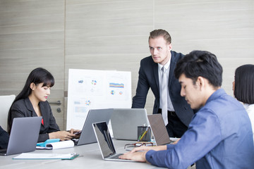 Young Business people working together with serious emotion. Business people takling in modern office. business people working concept