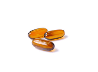 Vitamin Omega-3 fish oil capsules on white background,  brown capsules medicine