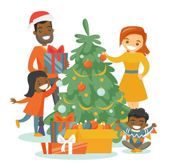 Obraz na płótnie Canvas Young happy multiethnic family decorating the Christmas tree