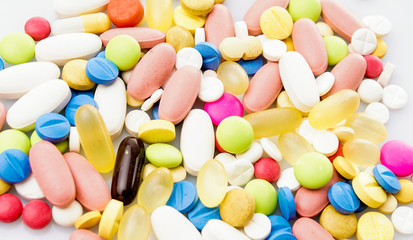 Fototapeta na wymiar Colorful pills. Medical or vitamin pills. Colorful medicine pills as texture. Pill pattern background