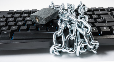Cyber attack threat secured, chained computer keyboard