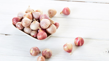 Fresh healthy garlic on white table
