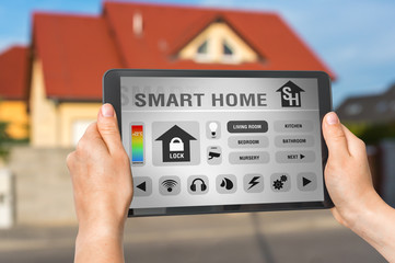 Smart home control app on tablet - smart home concept