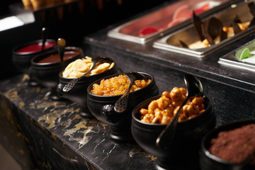 Different kinds of colorful fruit ice cream in boxes