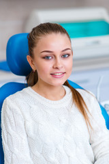 Beautiful girl smiles after teeth whitening.