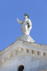 Fototapeta na wymiar 16th-century Benedictine San Giorgio Maggiore church, statue on the top, Venice, Italy.