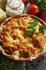 Fish baked with tomatoes, sour cream and cheese
