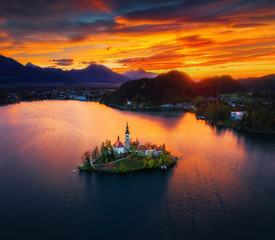 Aerial sunset view of church of Assumption in Lake Bled, Slovenia. Beautiful fall landscape.
