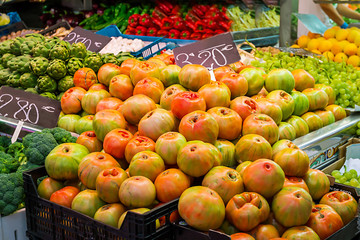 Fresh tomatoes in a market stall