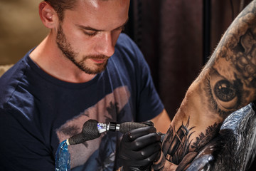 Close up tattoo artist