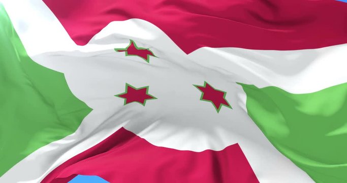 Burundi flag waving at wind in slow with blue sky, loop