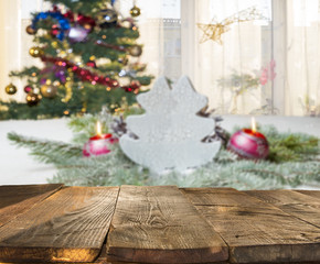 christmas table background with christmas tree out of focus