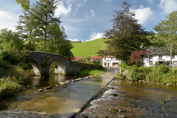 Fototapeta na wymiar Packhorse bridge and ford at Malmsmead, Exmoor, North Devon