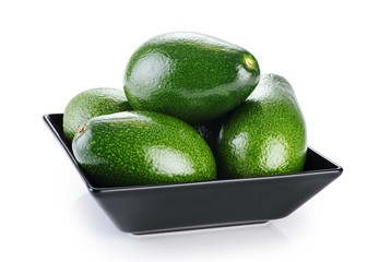 Bowl with avocado isolated on white background.