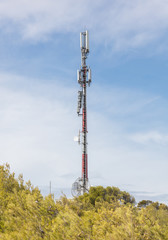 Tower communication sky. TV tower on a background of blue sky and clouds