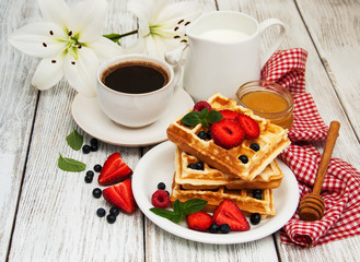 waffles with strawberries,  blueberry and coffee