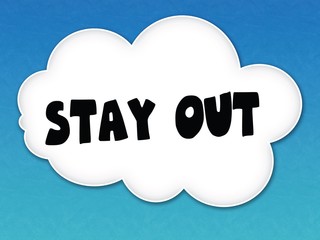 White cloud with STAY OUT message on blue sky background.
