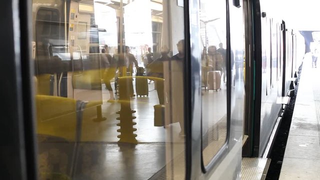 reflection of crowd of people commuters in the window of metro train