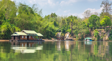 Fototapeta na wymiar Tourism on the floating house rafting at the river Kwai, Kanchanaburi, Thailand.