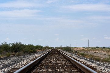 Fototapeta na wymiar Railroad track leading to distance