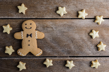 Festive Christmas Cookie and New Year in the shape of Gingerbread man, Snowflake, star on wooden table