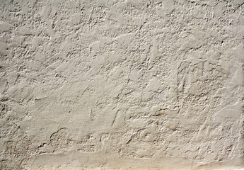 Old stucco wall texture of beige color