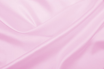 Smooth elegant pink silk or satin texture as wedding background. Luxurious background design