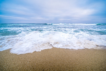 Waves rush San Diego