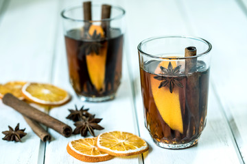 The Mulled wine on white table in night celebration of  New Year party and delicious Christmas drink for autumn and winter season