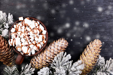 Christmas Food Sweet Marshmallow with Chocolate in Brown Cup on Black Background. Flat Lay