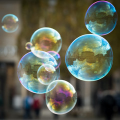 Soap bubbles in front of an trees reflection of Frauenkirche
