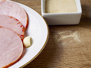 Pickled tenderloins in a plate on wood background