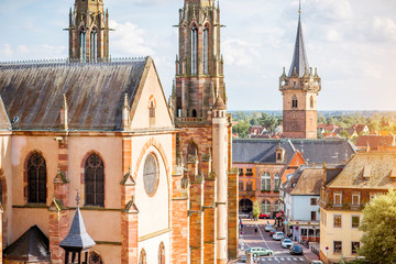 Cityscape view on the old cathedral and tower in Obernai village during the sunny day in Alsace...