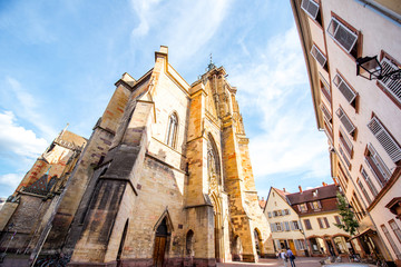 View on the saint Martins cathedral in the center of Colmar town during the sunny weather in Alsace region, France