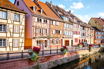 Landscape view on the beautiful colorful buildings on the water channel in the famous tourist town Colmar in Alsace region, France