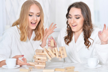  women playing with  blocks 