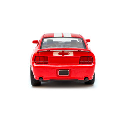 Photo of red toy model car isolated on white background