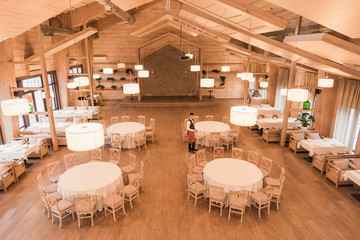 Waiter in empty restaurant